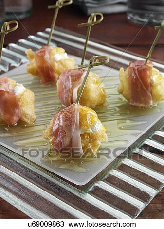 Stock Image - Zeppole fluffy savoury Italian beignets. Fotosearch