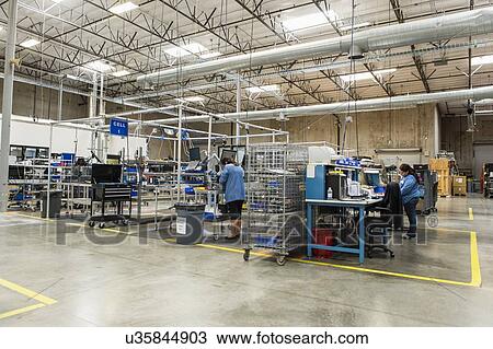 Full length of female technicians working in computer manufacturing industry View Large Photo Image Stock Image - Full length of female technicians working in computer manufacturing industry. Fotosearch