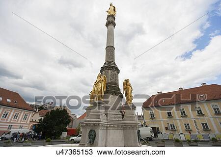 Golden angles on Madonna column at town square in Zagreb, Croatia View Large Photo Image Stock Image - Golden angles on Madonna column at town square in Zagreb, Croatia. Fotosearch