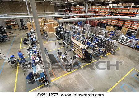 High angle view of multiethnic engineers working in computer manufacturing industry View Large Photo Image Stock Photo - High angle view of multiethnic engineers working in computer manufacturing industry. Fotosearch