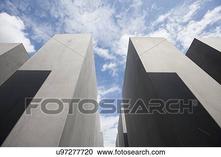 Low angle view of concrete blocks at Holocaust Memorial against cloudy sky, Berlin, Germany, Europe View Large Photo Image Stock Image - Low angle view of concrete blocks at Holocaust Memorial against cloudy sky, Berlin, Germany, Europe. Fotosearch