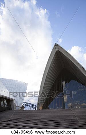 Low angle view of Opera House against cloudy sky, Sydney, Australia View Large Photo Image Stock Photograph - Low angle view of Opera House against cloudy sky, Sydney, Australia. Fotosearch