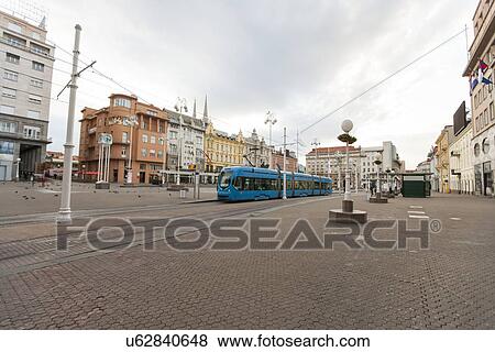 Stock Photo - Modern tram moving at Republic Square at Zagreb, Croatia. Fotosearch