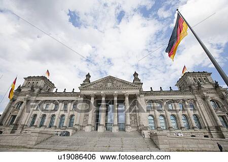 Stock Photograph - Reichstag building against cloudy sky, Berlin, Germany, Europe. Fotosearch