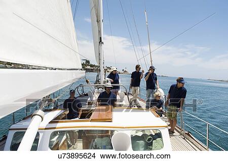 Picture - Sailing crew on yacht. Fotosearch