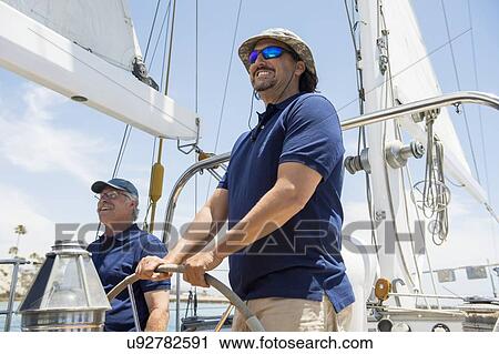 Smiling sailing crew on yacht View Large Photo Image Stock Image - Smiling sailing crew on yacht. Fotosearch