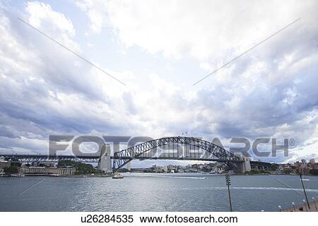 View of Harbor Bridge over sea, Sydney, Australia View Large Photo Image Stock Photography - View of Harbor Bridge over sea, Sydney, Australia. Fotosearch