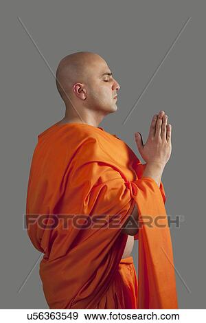 A monk praying View Large Photo Image Stock Photo - A monk praying . Fotosearch