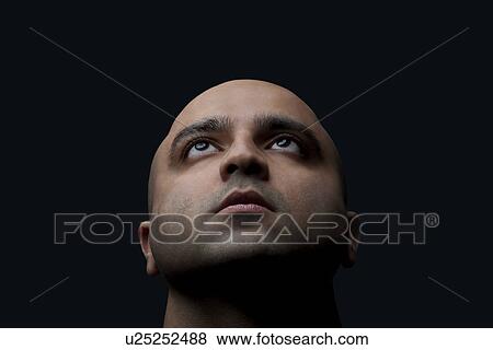 Stock Photo - Bald man looking up . Fotosearch