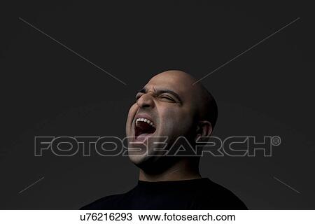 Stock Image - Bald man screaming . Fotosearch