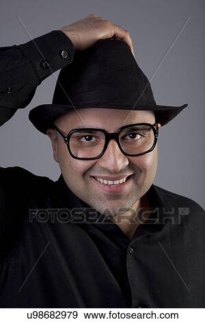 Stock Photo - Bald man wearing a hat . Fotosearch