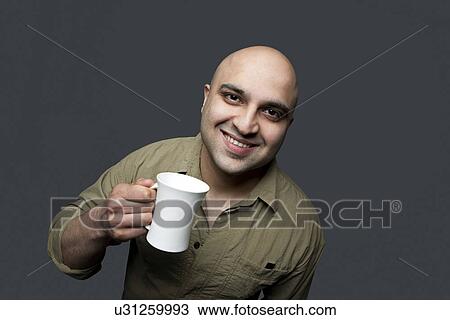 Bald man with a mug of tea View Large Photo Image Stock Image - Bald man with a mug of tea . Fotosearch