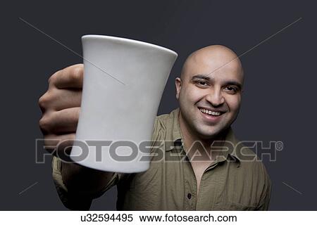 Bald man with a mug of tea View Large Photo Image Stock Photography - Bald man with a mug of tea . Fotosearch