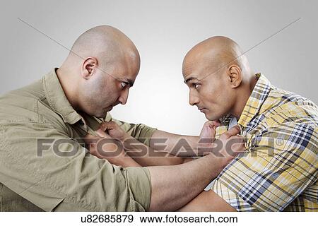 Stock Photo - Bald men fighting . Fotosearch