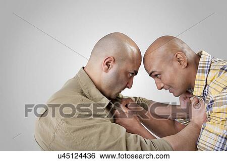 Stock Photograph - Bald men fighting . Fotosearch