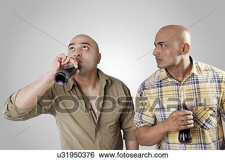 Stock Photograph - Bald men having a drink . Fotosearch