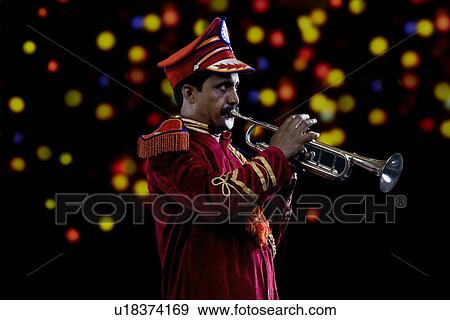 Stock Photo - Bandmaster playing on a trumpet . Fotosearch