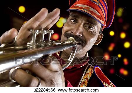 Bandmaster playing on a trumpet View Large Photo Image Stock Photograph - Bandmaster playing on a trumpet . Fotosearch