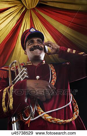 Bandmaster talking on a mobile phone View Large Photo Image Stock Photo - Bandmaster talking on a mobile phone . Fotosearch