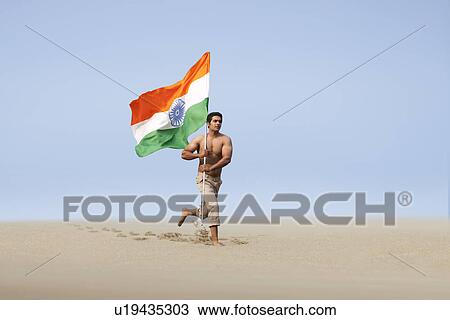 Bare chested man running with the Indian flag  View Large Photo Image Stock Image - Bare chested man running with the Indian flag . Fotosearch