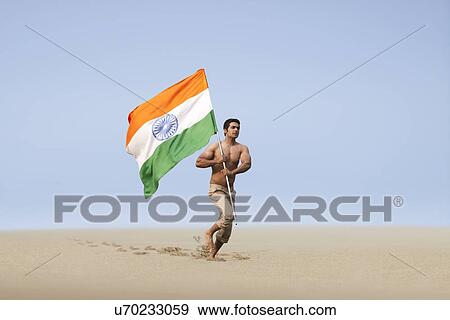Bare chested man running with the Indian flag View Large Photo Image Stock Photo - Bare chested man running with the Indian flag . Fotosearch