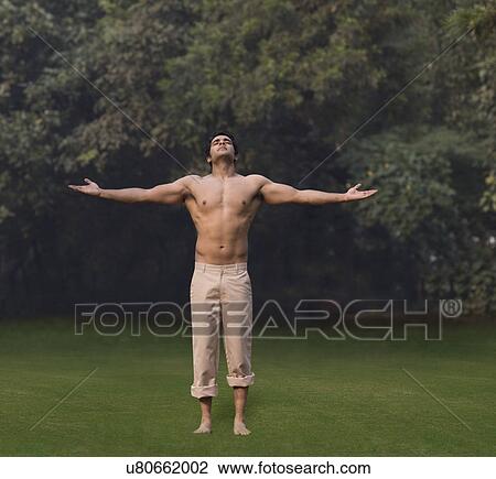 Bare chested man with arms outstretched View Large Photo Image Stock Image - Bare chested man with arms outstretched . Fotosearch
