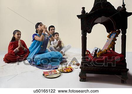 Bengali family performing a puja View Large Photo Image Stock Image - Bengali family performing a puja . Fotosearch