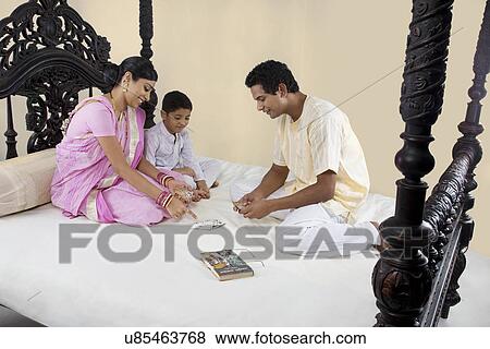 Bengali family playing cards View Large Photo Image Stock Photo - Bengali family playing cards . Fotosearch