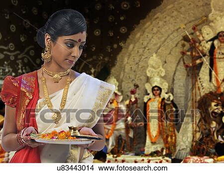 Bengali woman celebrating Durga puja View Large Photo Image Picture - Bengali woman celebrating Durga puja . Fotosearch
