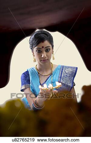 Stock Photo - Bengali woman doing a puja . Fotosearch
