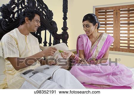 Bengali woman offering paan to her husband View Large Photo Image Stock Image - Bengali woman offering paan to her husband . Fotosearch