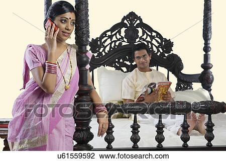 Bengali woman talking on a mobile phone View Large Photo Image Stock Image - Bengali woman talking on a mobile phone . Fotosearch