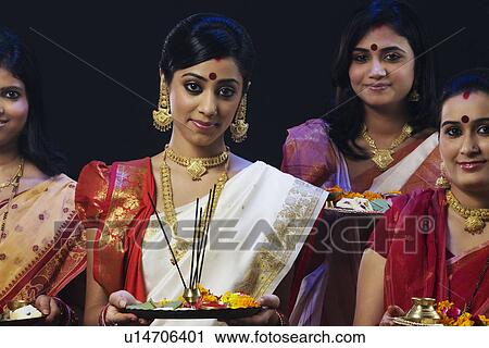 Bengali women celebrating Durga puja View Large Photo Image Stock Image - Bengali women celebrating Durga puja . Fotosearch