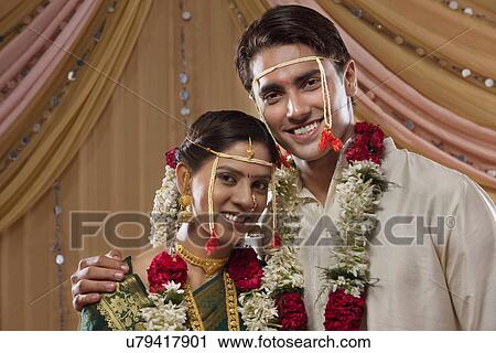 Bride and groom smiling after wedding ceremony View Large Photo Image Stock Image - Bride and groom smiling after wedding ceremony . Fotosearch