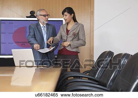 Business executives having a discussion in a conference room View Large Photo Image Stock Photography - Business executives having a discussion in a conference room. Fotosearch