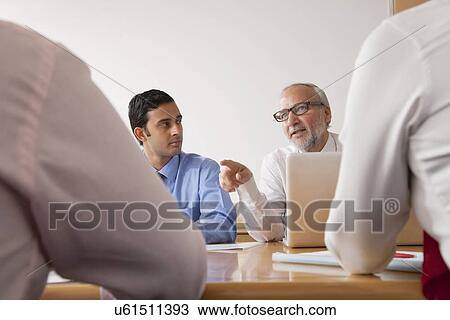 Business executives in a meeting View Large Photo Image Stock Image - Business executives in a meeting. Fotosearch