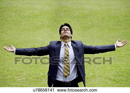 Stock Image - Businessman enjoying the outdoors . Fotosearch