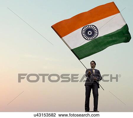 Businessman holding the Indian flag View Large Photo Image Stock Image - Businessman holding the Indian flag . Fotosearch