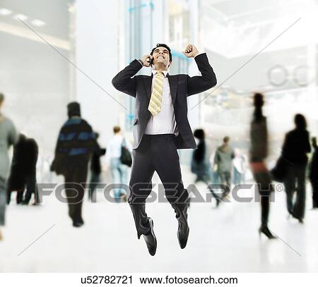 Businessman jumping in the air View Large Photo Image Stock Image - Businessman jumping in the air . Fotosearch