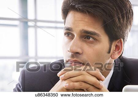Stock Image - Businessman thinking . Fotosearch