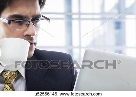 Businessman with a cup of coffee View Large Photo Image Stock Photography - Businessman with a cup of coffee . Fotosearch