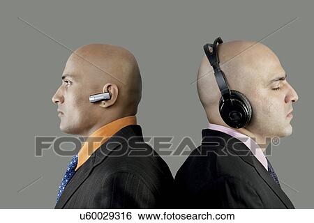 Businessmen with headphones and blue-tooth View Large Photo Image Stock Photograph - Businessmen with headphones and blue-tooth . Fotosearch