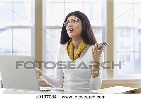 Stock Image - Businesswoman getting frustrated . Fotosearch