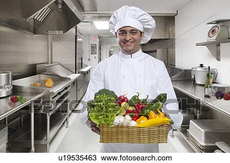 Chef carrying a basket of fresh vegetables View Large Photo Image Stock Image - Chef carrying a basket of fresh vegetables . Fotosearch