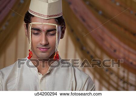 Close-up of Maharashtrian groom looking down View Large Photo Image Picture - Close-up of Maharashtrian groom looking down . Fotosearch