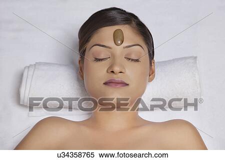 Close-up of woman getting hot stone treatment View Large Photo Image Stock Photography - Close-up of woman getting hot stone treatment . Fotosearch