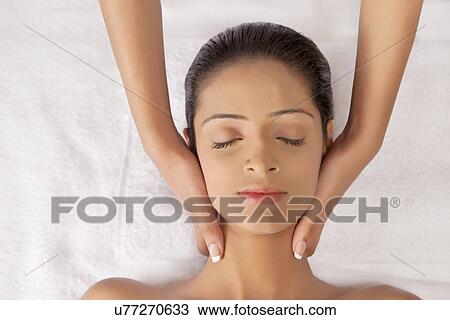 Close-up of woman receiving massage View Large Photo Image Stock Image - Close-up of woman receiving massage . Fotosearch