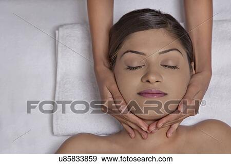 Close-up of woman receiving massage View Large Photo Image Stock Photo - Close-up of woman receiving massage . Fotosearch