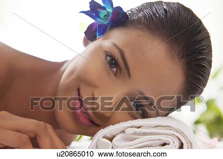 Close-up portrait of woman relaxing her head on towel View Large Photo Image Stock Image - Close-up portrait of woman relaxing her head on towel . Fotosearch