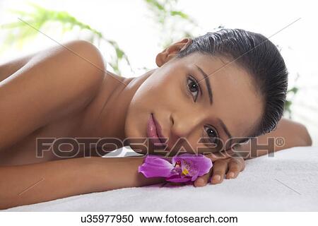 Close-up portrait of young woman on massage table View Large Photo Image Stock Image - Close-up portrait of young woman on massage table . Fotosearch